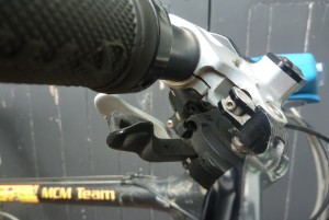 This screw is on the inside and needs a small allen key.