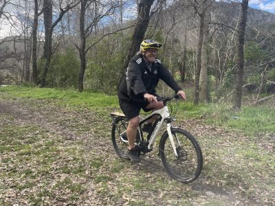 Older man on E-Bike wearing comfortable movement clothing and mens padded bike underwear.
